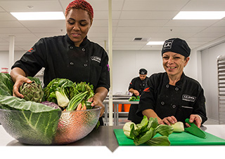 Two LA Kitchen chefs prepare healthy meals for seniors