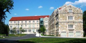 A view of the stone buildings and red roof of St. Paul's School in Washington, DC