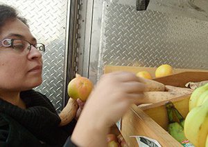 Woman shops at mobile farmers market