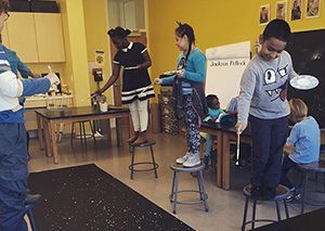 Students paint a large mural together