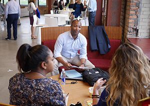 Capital Impact staff members have a group discussion.