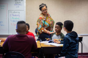 Children and their teacher in a classroom